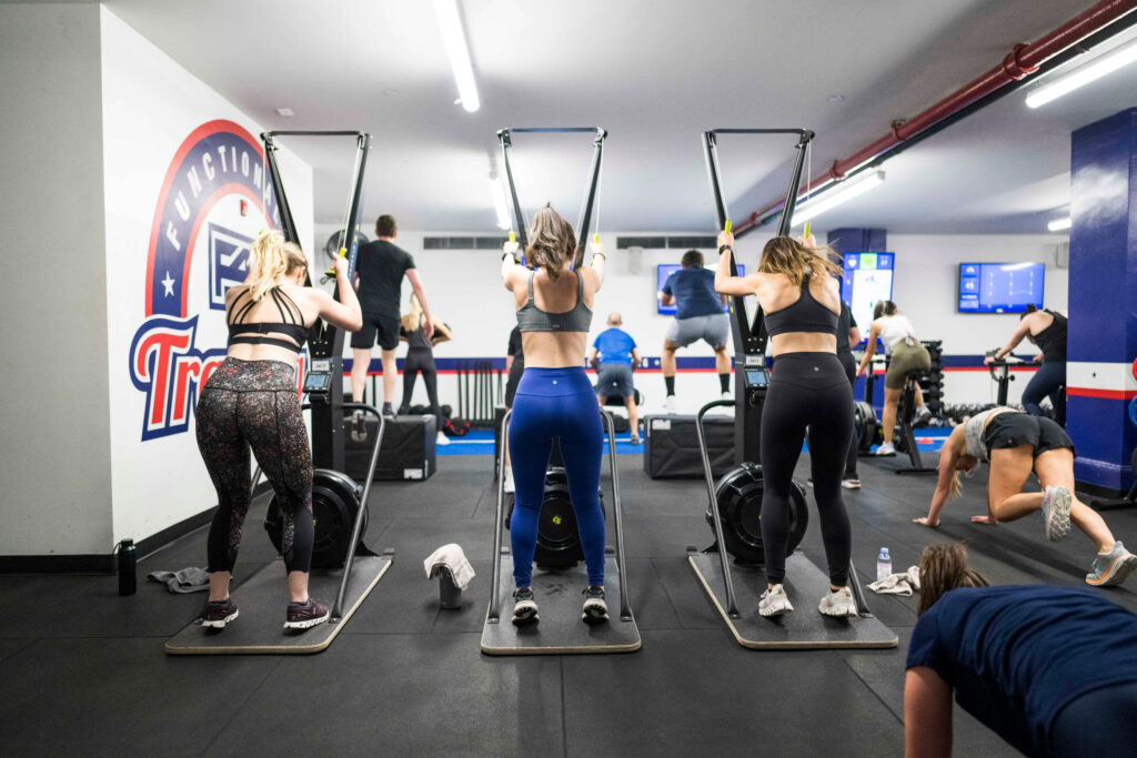 "Group training session at F45 Ventura County with members supporting and motivating each other.